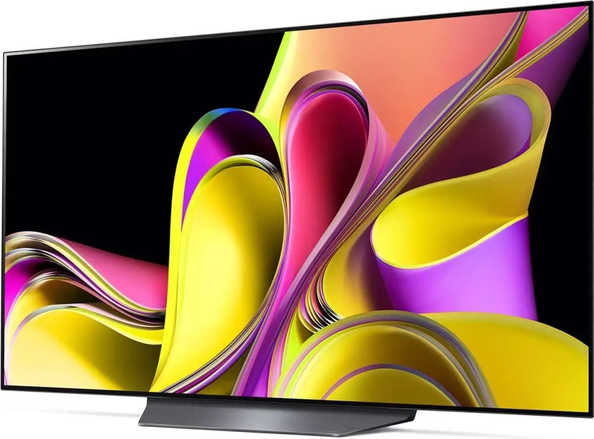 LG-tv met gele en paarse kleuren, schuin zij-aanzicht